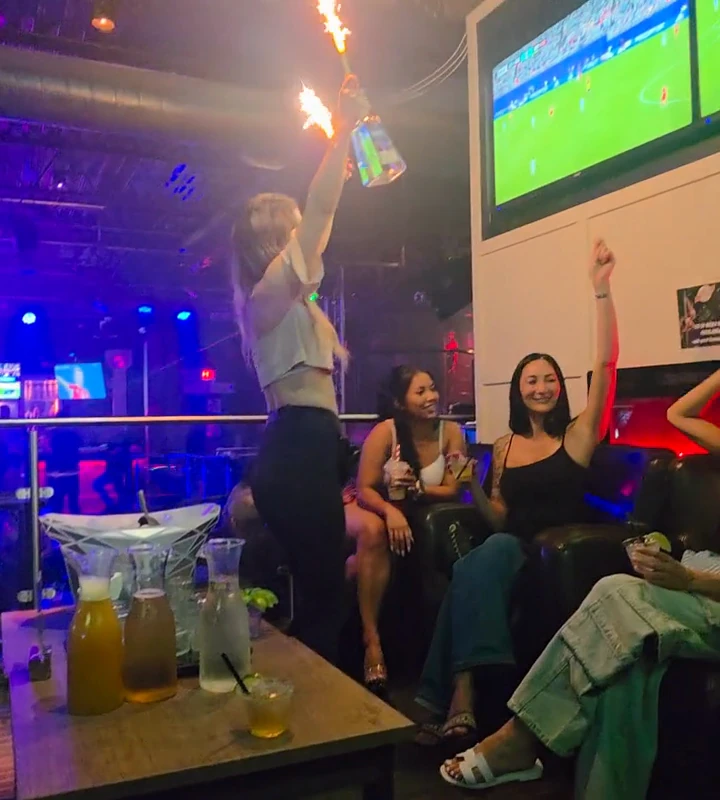 Sparkler bottle service with guests inside Whiskey A Go-Go